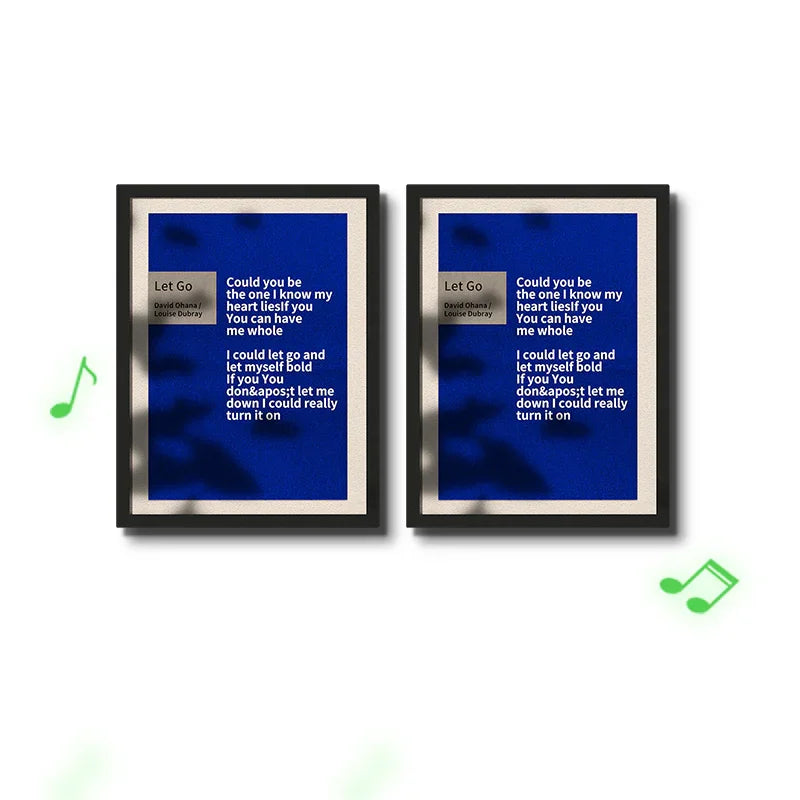Two framed blue lyric posters titled Let Go displayed side by side with music notes around them.