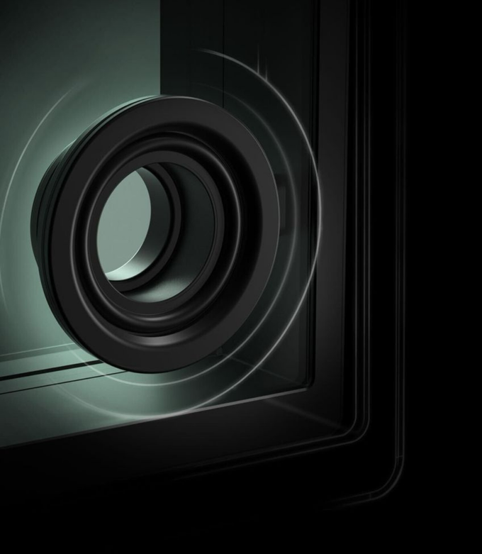 Close-up of a camera lens with a dark background