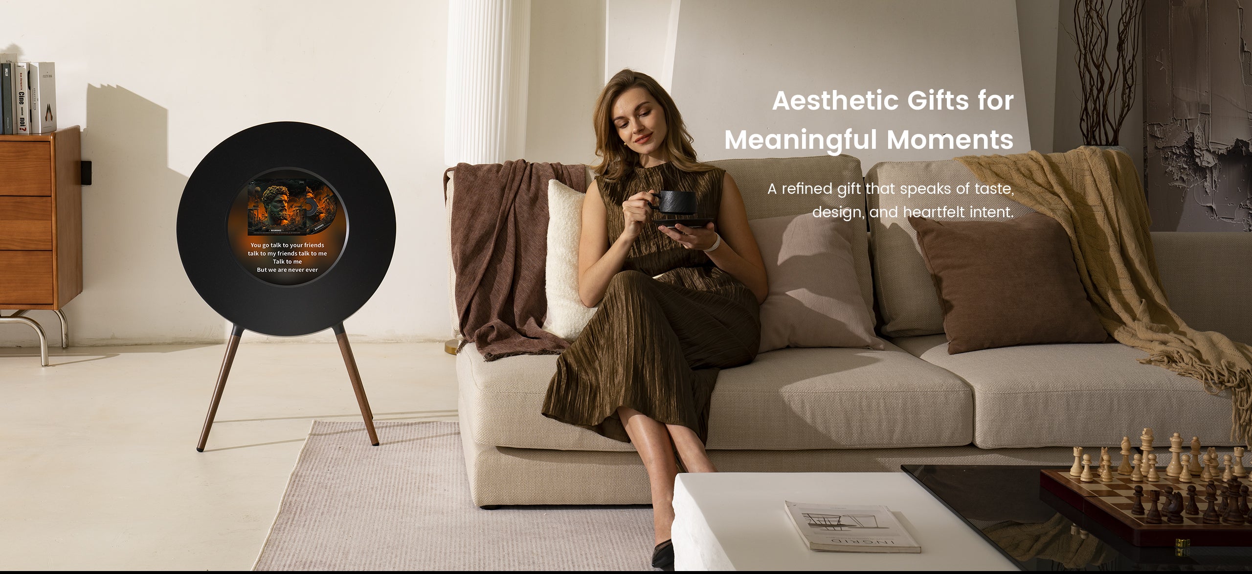 Woman sitting on a couch with a vinyl record and a coffee cup, surrounded by home decor items.